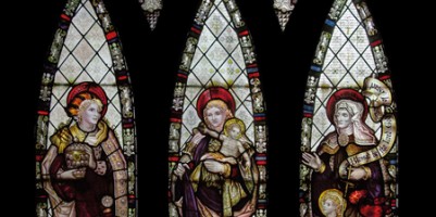 CE Kempe stained glass in the chancel, 1888. St Mary Magdalene, the Virgin Mary and St Elizabeth.