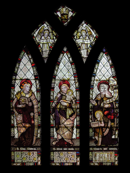 CE Kempe stained glass in the chancel, 1888. St Mary Magdalene, the Virgin Mary and St Elizabeth.