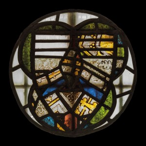 Fragments of early glass, mounted in a roundel and placed onto one of the baptistry windows.