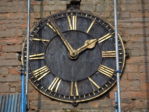 West face of clock showing corrosion and loose or missing mounts