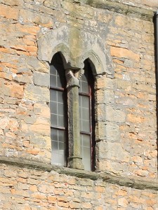 Close up of damage and erosion to south face tower window