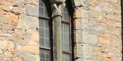 Close up of damage and erosion to south face tower window