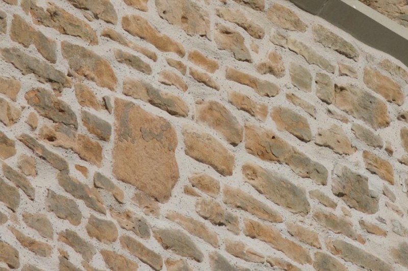 Close up of cleaned and repointed tower stonework