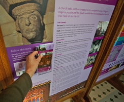 Taking a tour leaflet from the church interpretation display