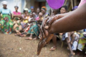 Christian Aid picture of person washing hands in clean water